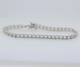 Sterling silver semi-mount tennis bracelet setting with stainless steel tongue, designed for customizable gemstone placement.